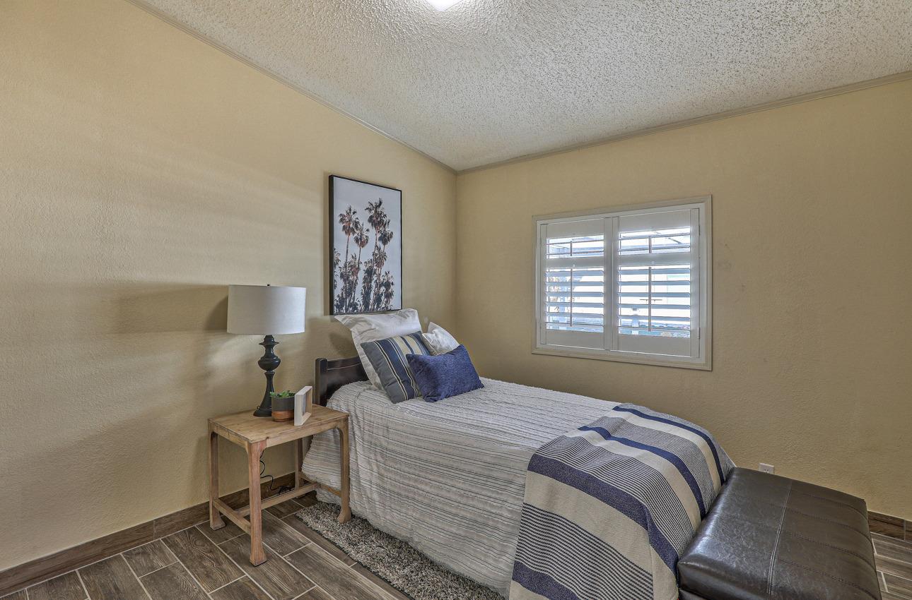20 Russell Road, Unit 131 Salinas, CA 93906 - Photo 8 of 9 a bedroom with a bed and a window