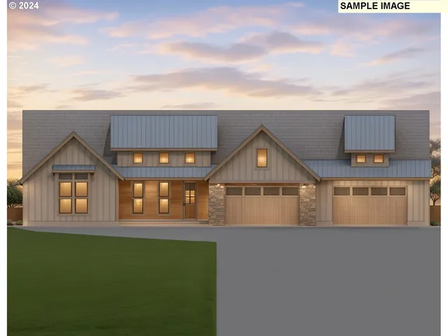 a front view of a house with a garden and yard