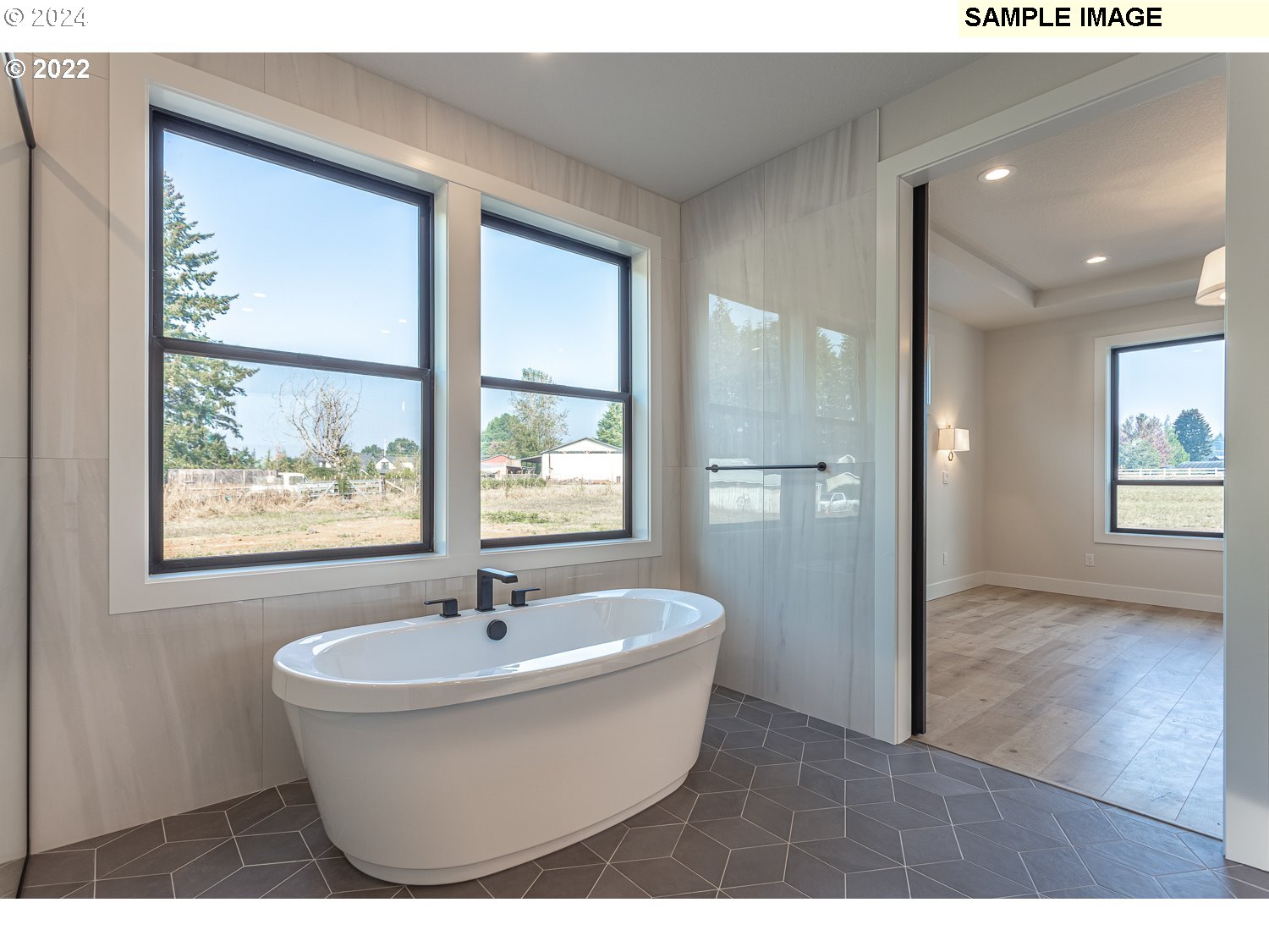 23322 Southeast Bohna Park Road Damascus, OR 97089 - Photo 11 of 40 a white bath tub sitting next to a window