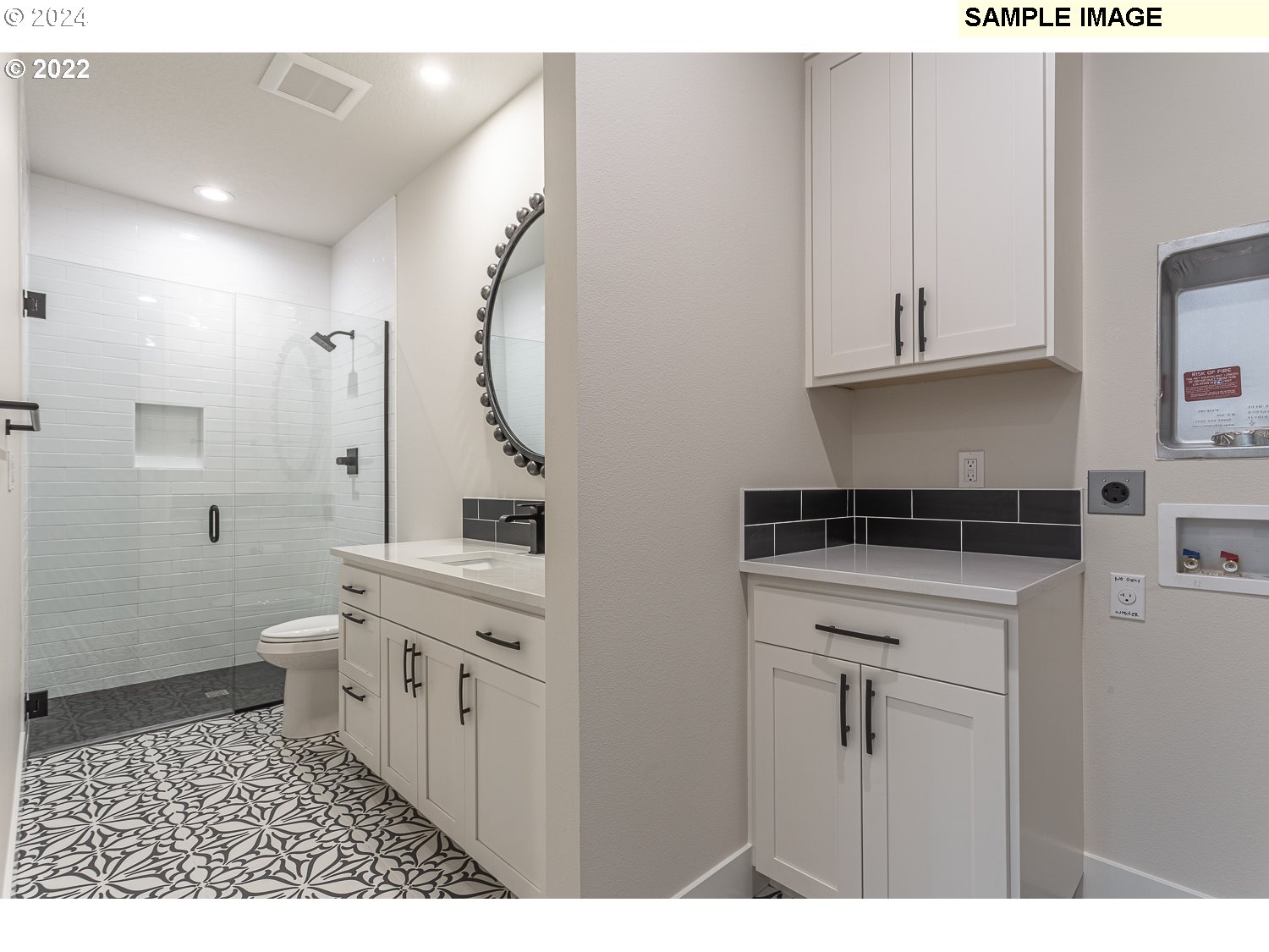 23322 Southeast Bohna Park Road Damascus, OR 97089 - Photo 18 of 40 a bathroom with a sink a toilet and a mirror