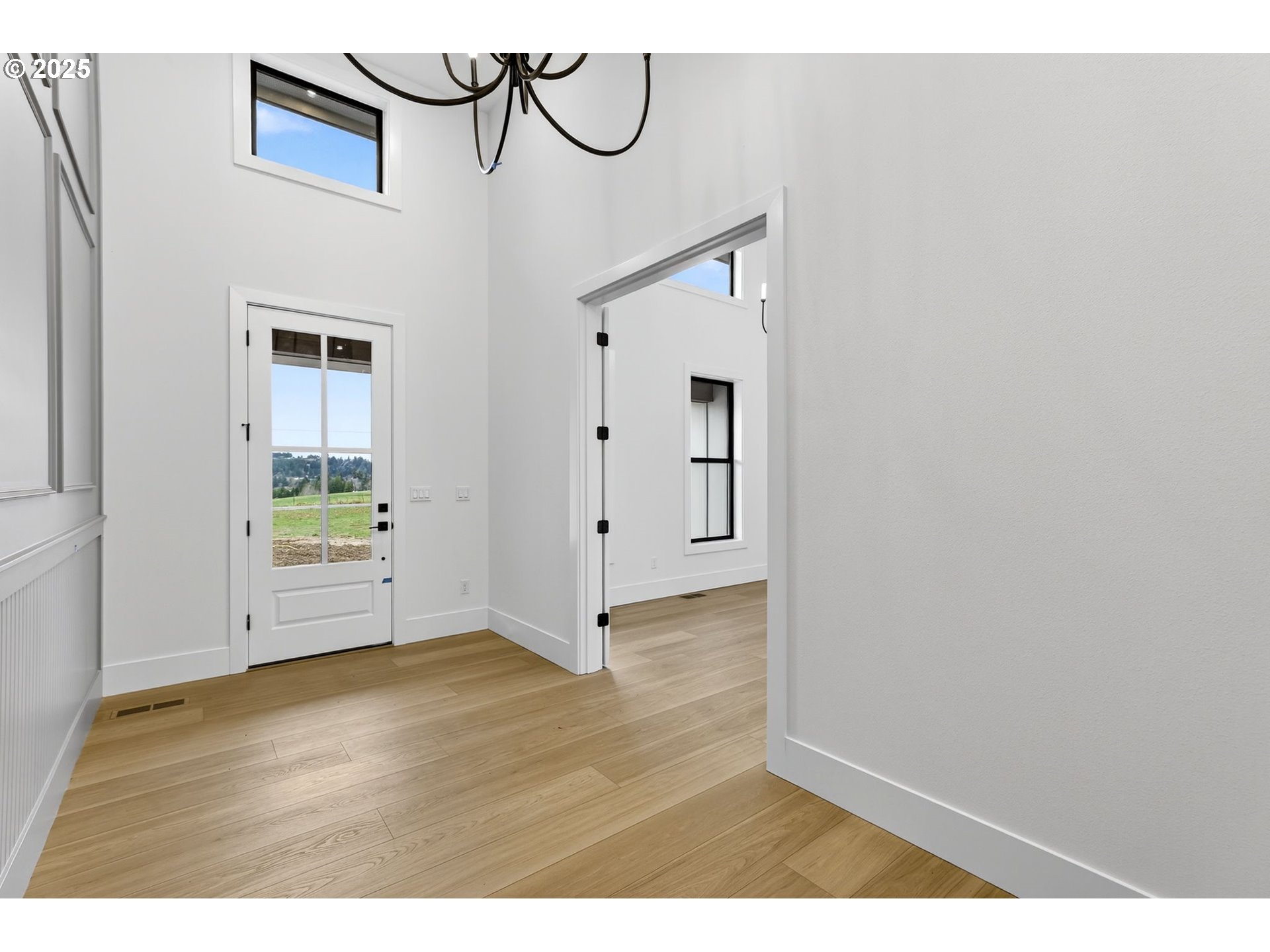 23322 Southeast Bohna Park Road Damascus, OR 97089 - Photo 29 of 40 a view of empty room with wooden floor