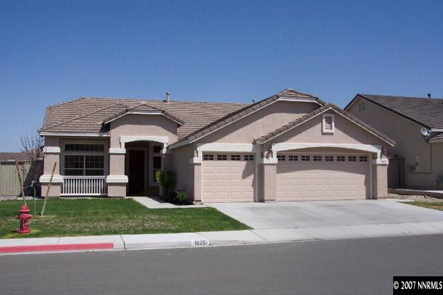 1605 Arboleda Drive Reno, NV 89521 - Photo 1 of 9 a front view of a house with a yard and garage