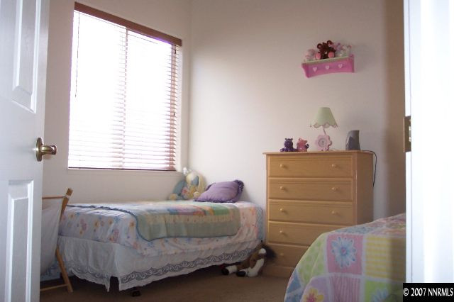 1605 Arboleda Drive Reno, NV 89521 - Photo 6 of 9 a bedroom with a bed and a window