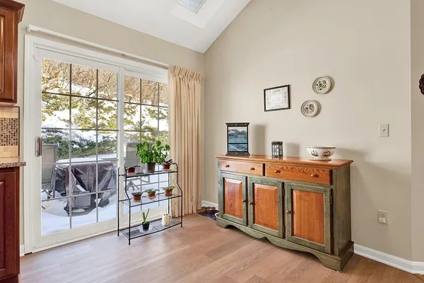 a kitchen with granite countertop cabinets stainless steel appliances and a sink