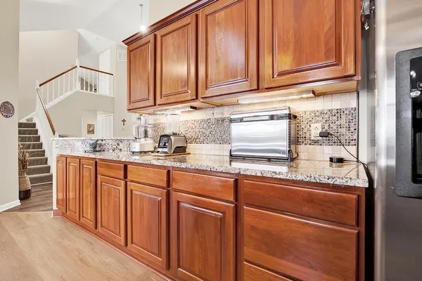 a view of a kitchen with furniture and windows