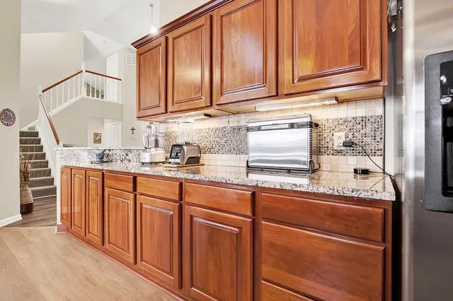a view of a kitchen with furniture and windows