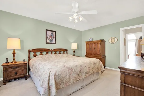a view of a livingroom with furniture and a bedroom