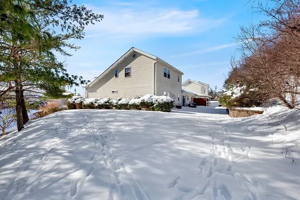 a view of a patio with furniture and a garage