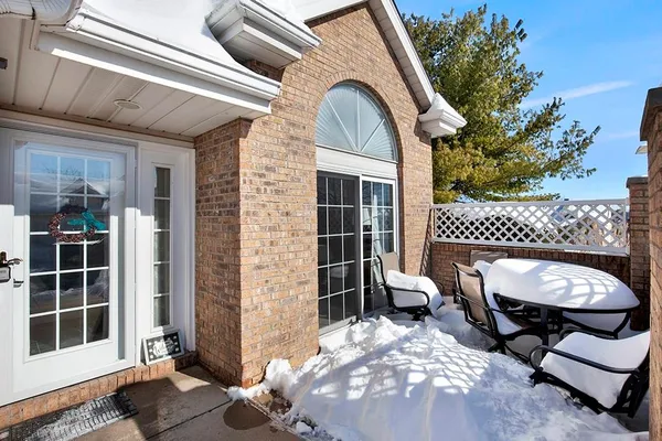 a view of a patio with a chairs and table in the patio