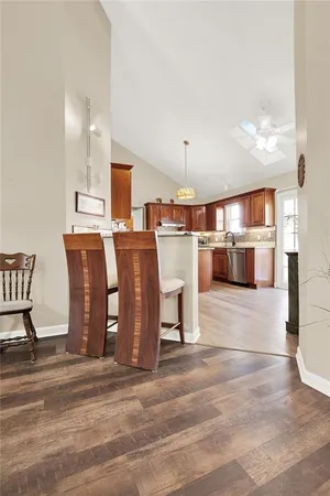 a kitchen with stainless steel appliances granite countertop a stove a sink dishwasher and a refrigerator