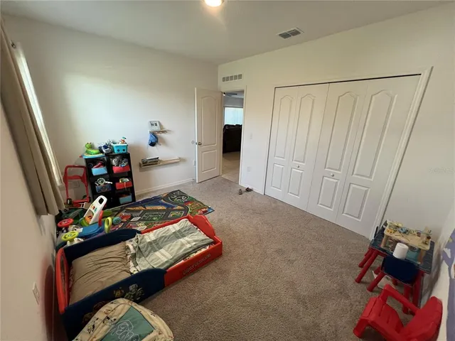 a bathroom with a sink a toilet and shower a mirror