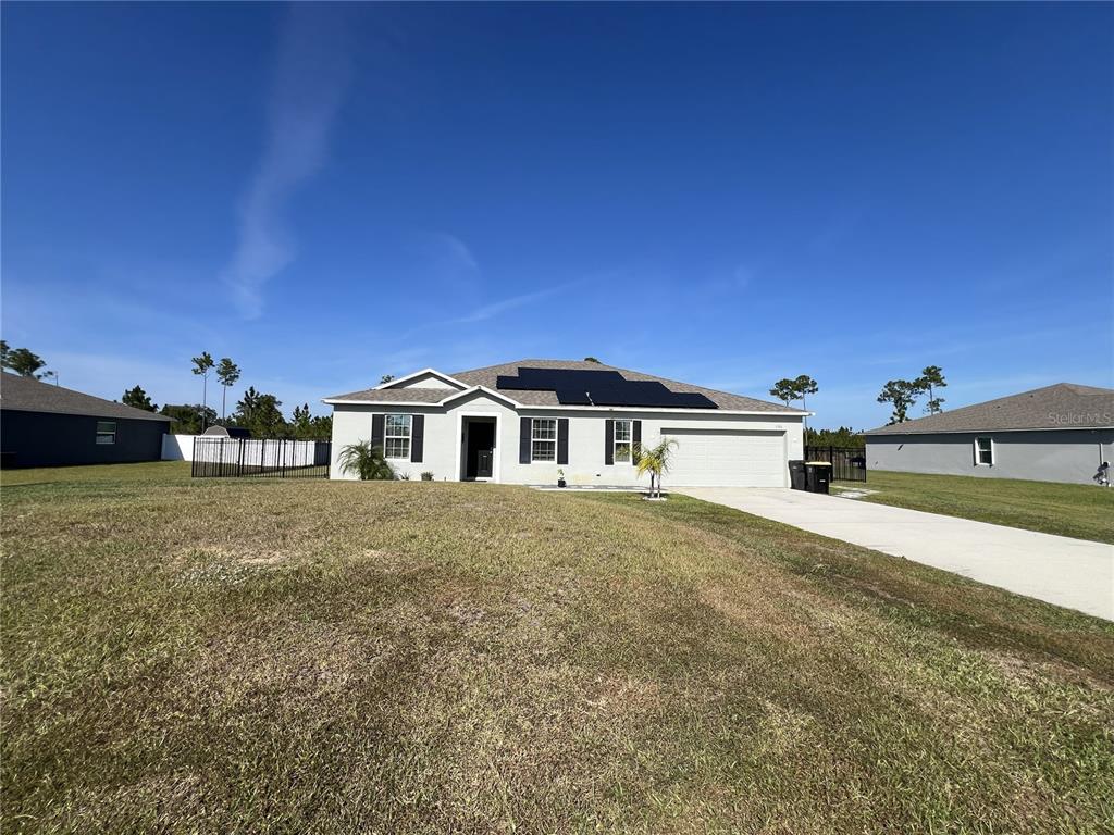 1106 Althea Drive Indian Lake Estates, FL 33843 - Photo 21 of 56 a front view of a house with a yard