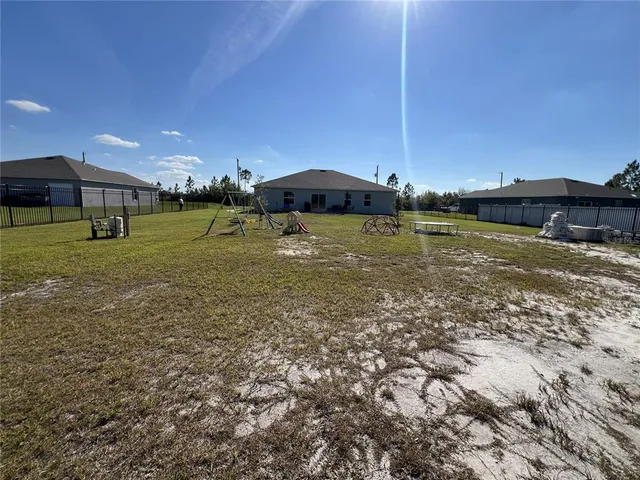 a view of a lake with a table and chairs