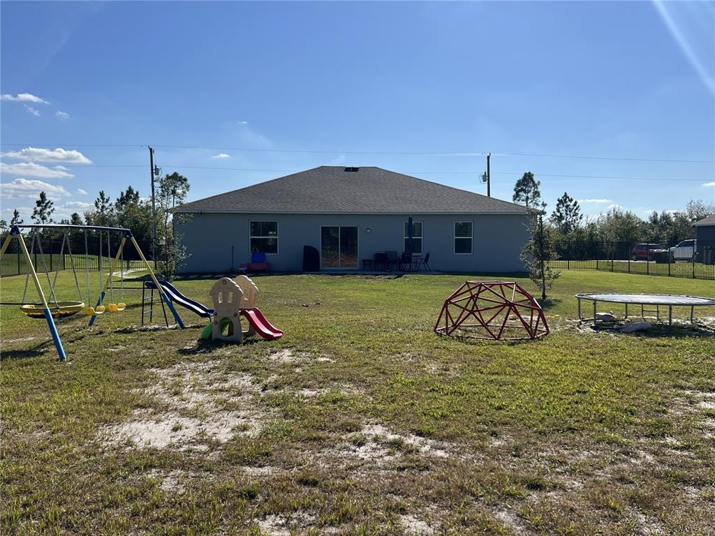 1106 Althea Drive Indian Lake Estates, FL 33843 - Photo 27 of 56 a view of a house with backyard