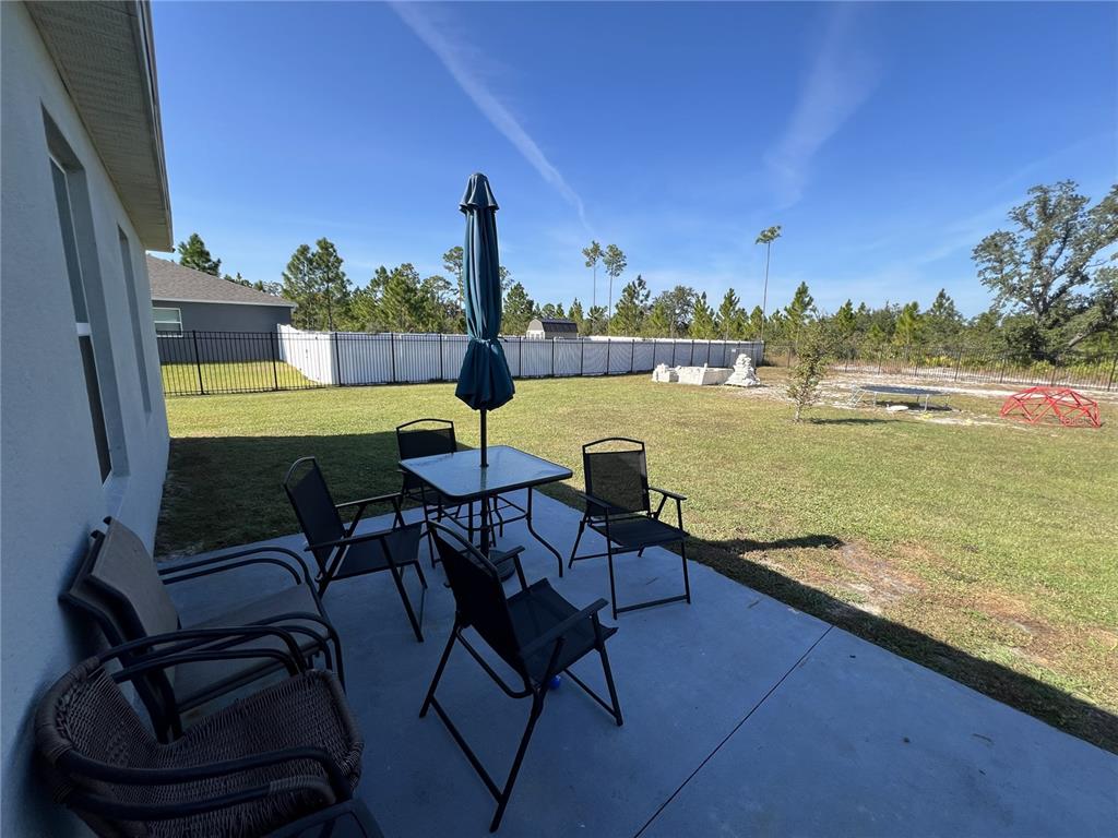 1106 Althea Drive Indian Lake Estates, FL 33843 - Photo 28 of 56 a view of a lake with table and chairs