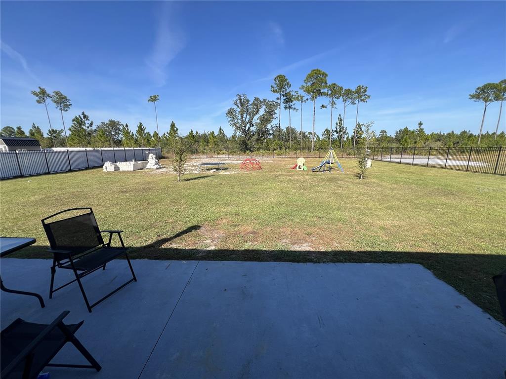 1106 Althea Drive Indian Lake Estates, FL 33843 - Photo 29 of 56 a view of a lake with a table and chairs