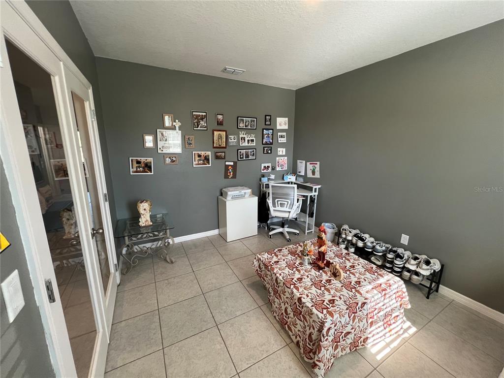 1106 Althea Drive Indian Lake Estates, FL 33843 - Photo 8 of 56 a bed sitting in a room next to a window