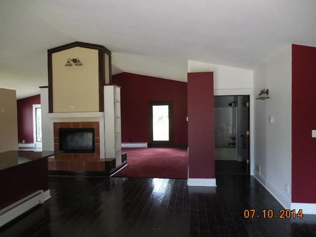 10747 East Miller Road Davis, IL 61019 - Photo 3 of 20 a view of a livingroom with furniture a fireplace and wooden floor
