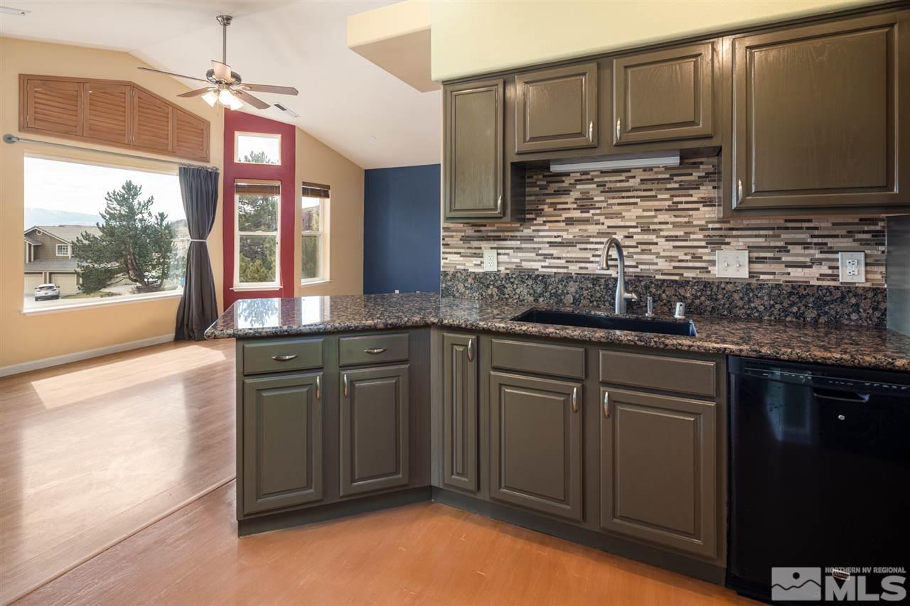 2259 Ridgeview Drive Reno, NV 89519 - Photo 14 of 39 a kitchen with granite countertop a sink stainless steel appliances and cabinets