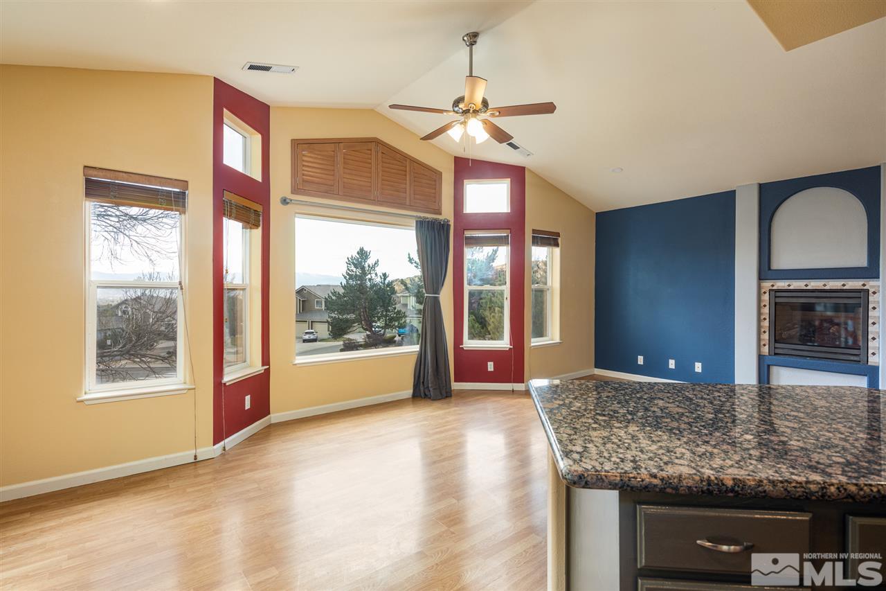 2259 Ridgeview Drive Reno, NV 89519 - Photo 15 of 39 a view of an empty room with a window and kitchen view