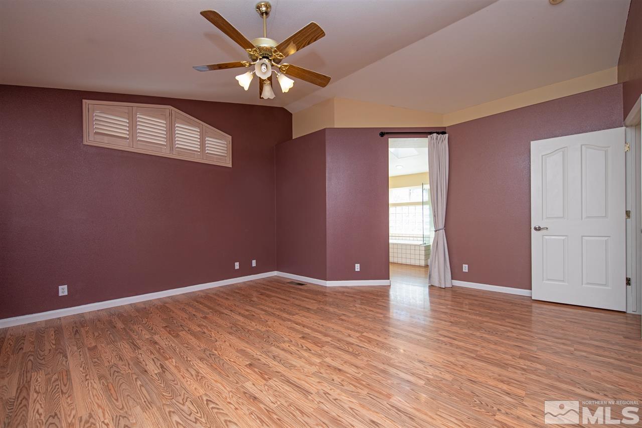 2259 Ridgeview Drive Reno, NV 89519 - Photo 16 of 39 a view of an empty room with wooden floor and a window