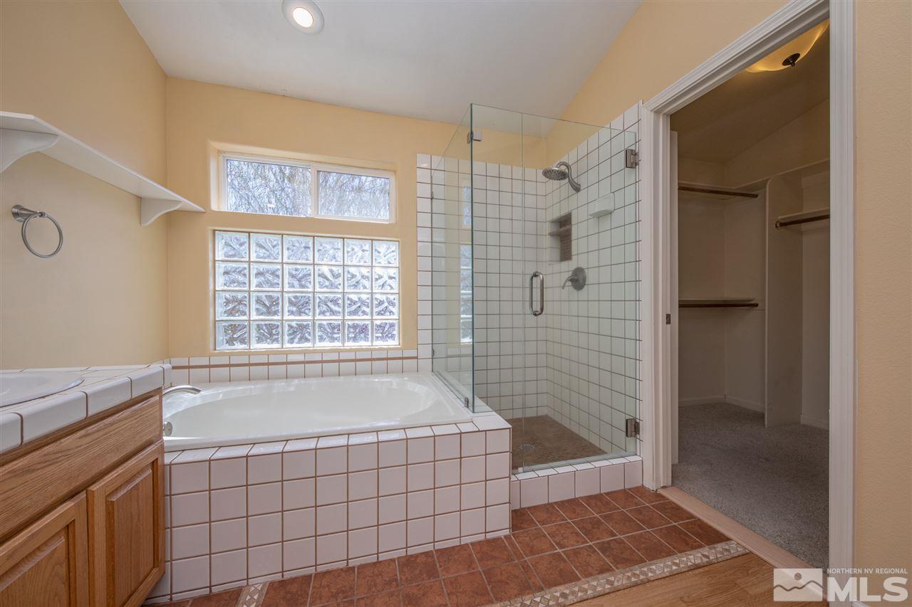 2259 Ridgeview Drive Reno, NV 89519 - Photo 19 of 39 a spacious bathroom with a tub shower and a sink