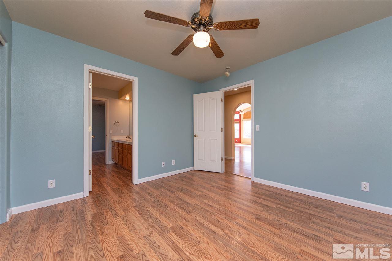 2259 Ridgeview Drive Reno, NV 89519 - Photo 21 of 39 wooden floor in an empty room with a window