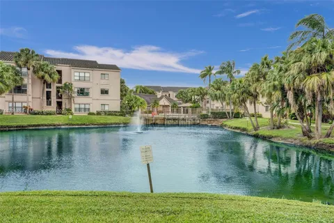 a view of a lake with a building in the background
