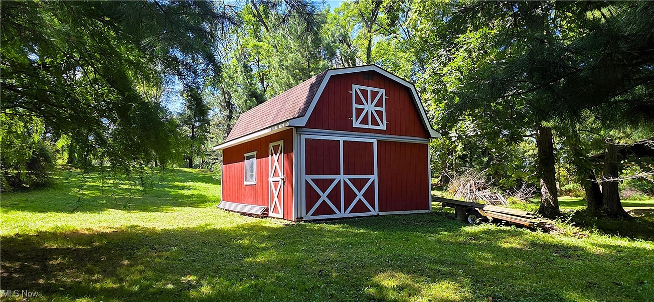 15485 Albion Road Strongsville, OH 44136 - Photo 5 of 36 Large storage barn with a loft for all of the yard equipment and more!