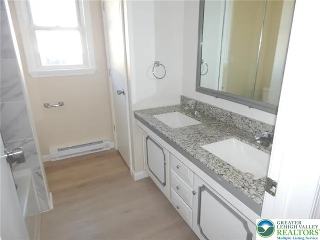 a white toilet sitting next to a window