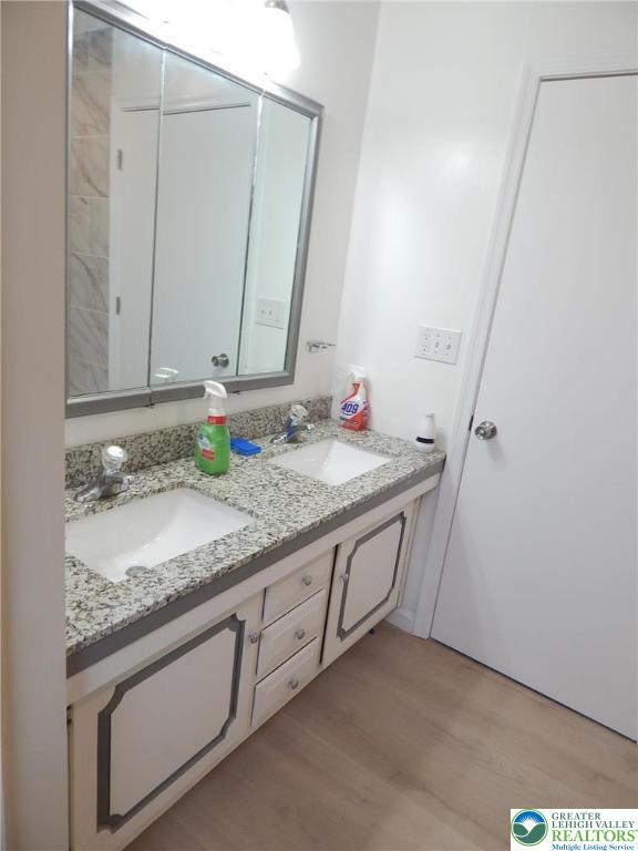4117 Grape Street Coplay, PA 18037 - Photo 18 of 41 a bathroom with a granite countertop sink and a mirror