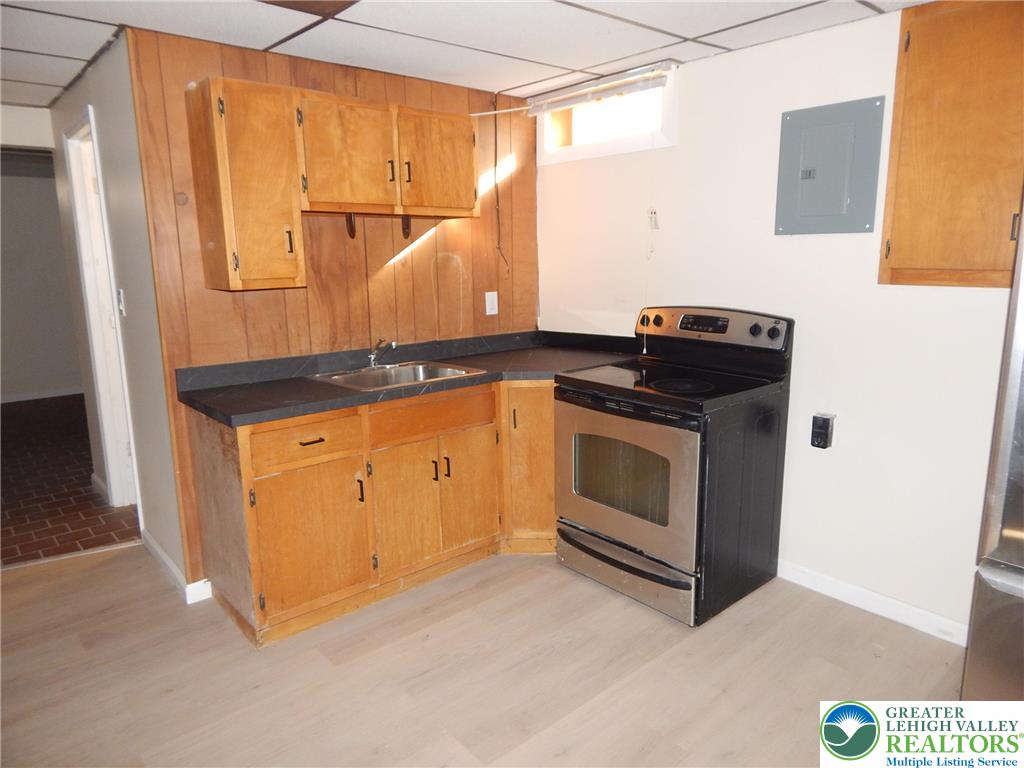 4117 Grape Street Coplay, PA 18037 - Photo 30 of 41 a kitchen with a stove and a microwave