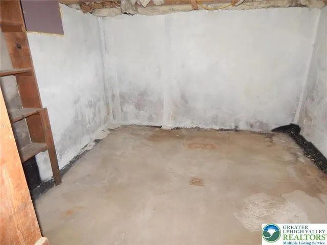 a backyard of a house with garden and plants