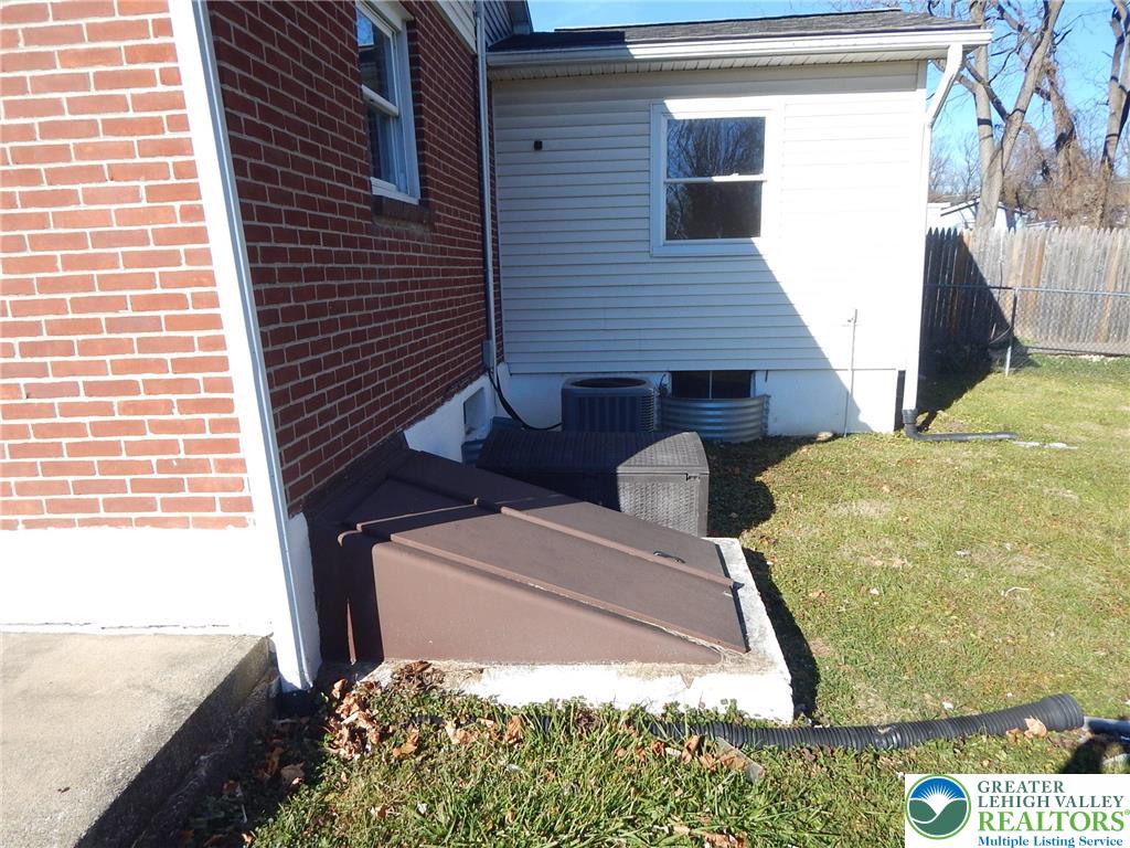 4117 Grape Street Coplay, PA 18037 - Photo 37 of 41 a backyard of a house with large trees and plants