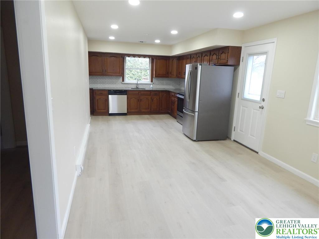 4117 Grape Street Coplay, PA 18037 - Photo 5 of 41 a view of kitchen with refrigerator and microwave