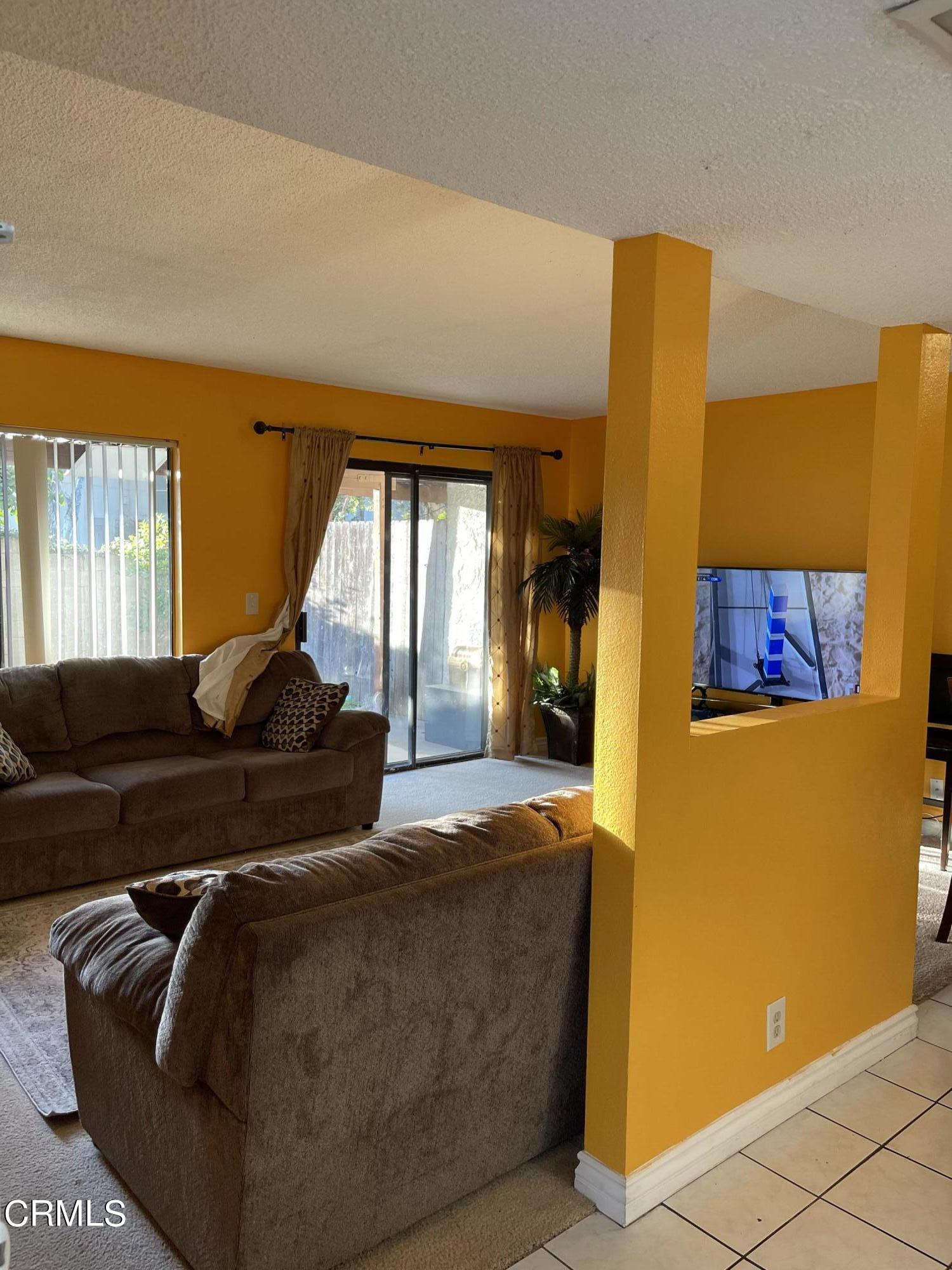 264 East Bard Road Oxnard, CA 93033 - Photo 3 of 17 a living room with furniture and a large window