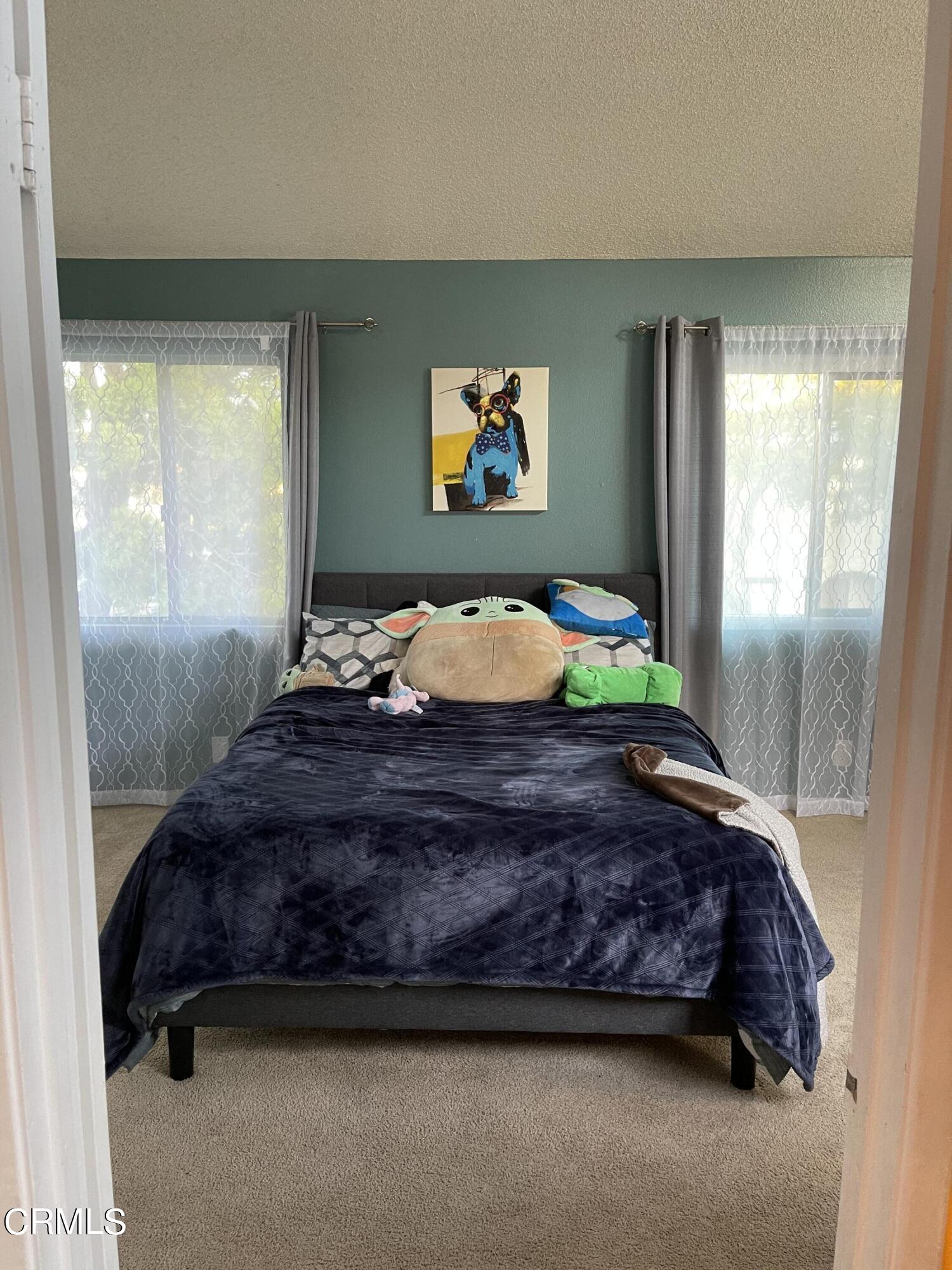 264 East Bard Road Oxnard, CA 93033 - Photo 10 of 17 a bedroom with a bed and window