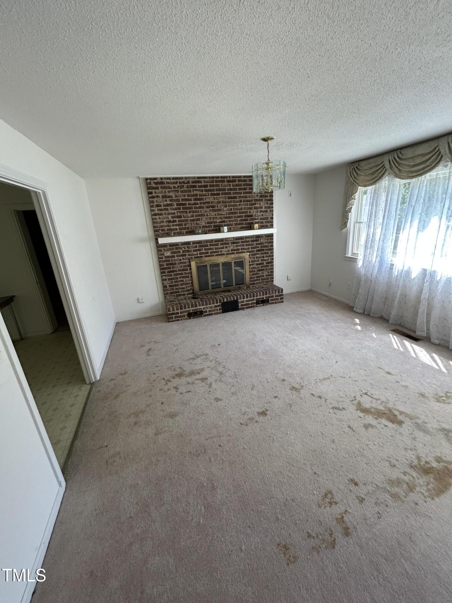 683 Osgood Road Sanford, NC 27330 - Photo 2 of 13 a view of an empty room with a window