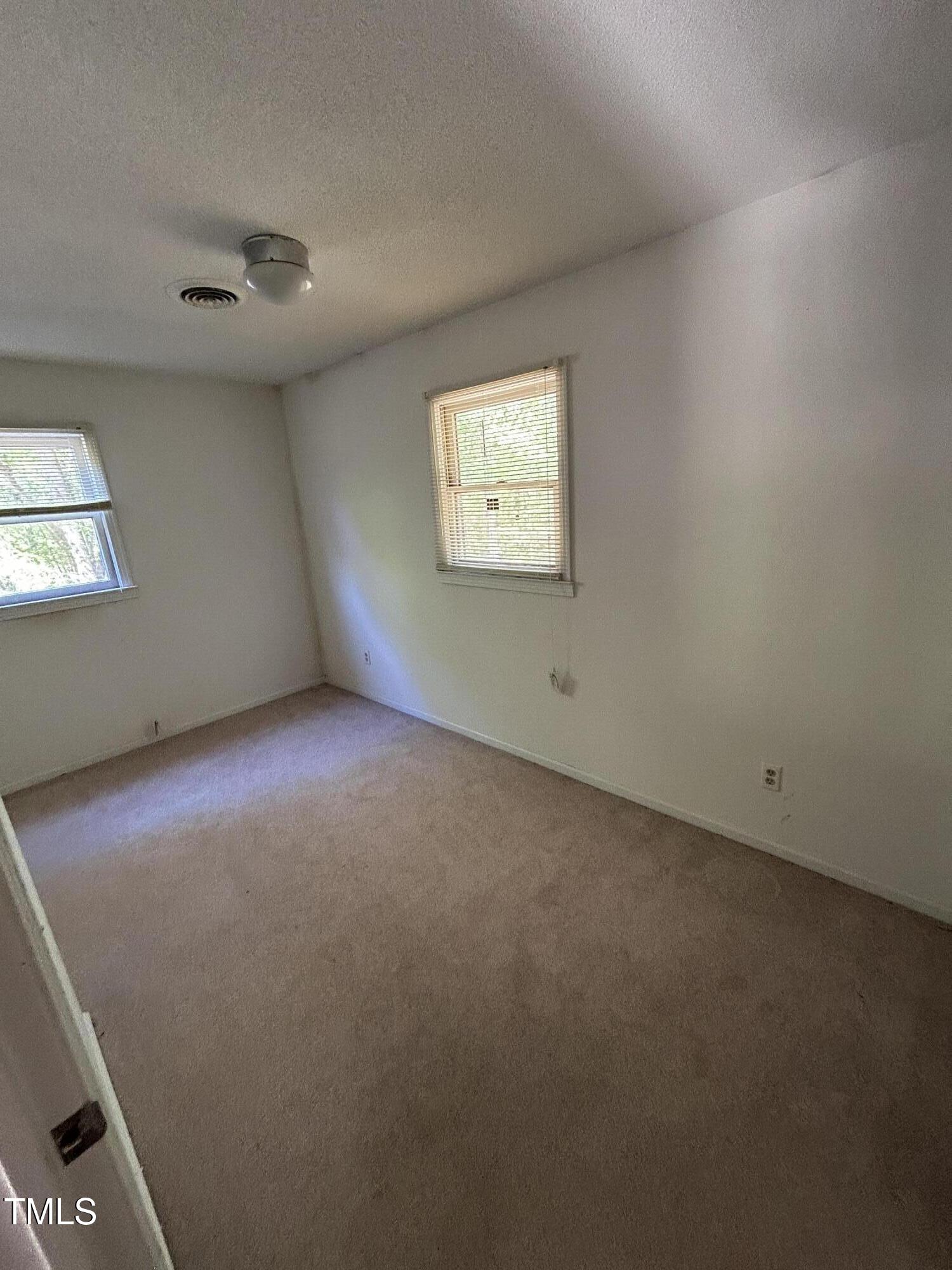 683 Osgood Road Sanford, NC 27330 - Photo 6 of 13 an empty room with windows