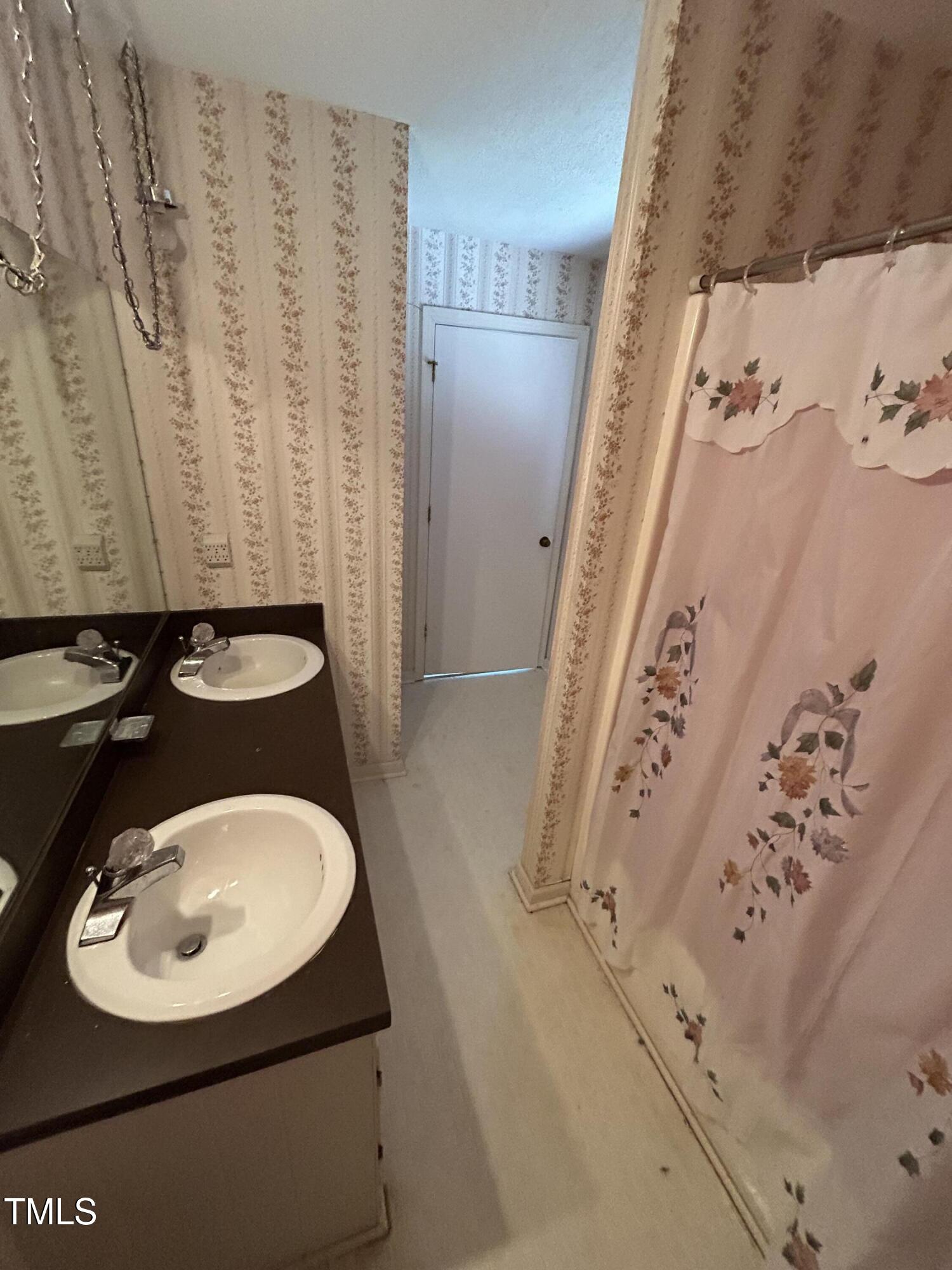 683 Osgood Road Sanford, NC 27330 - Photo 8 of 13 a bathroom with a sink and a mirror