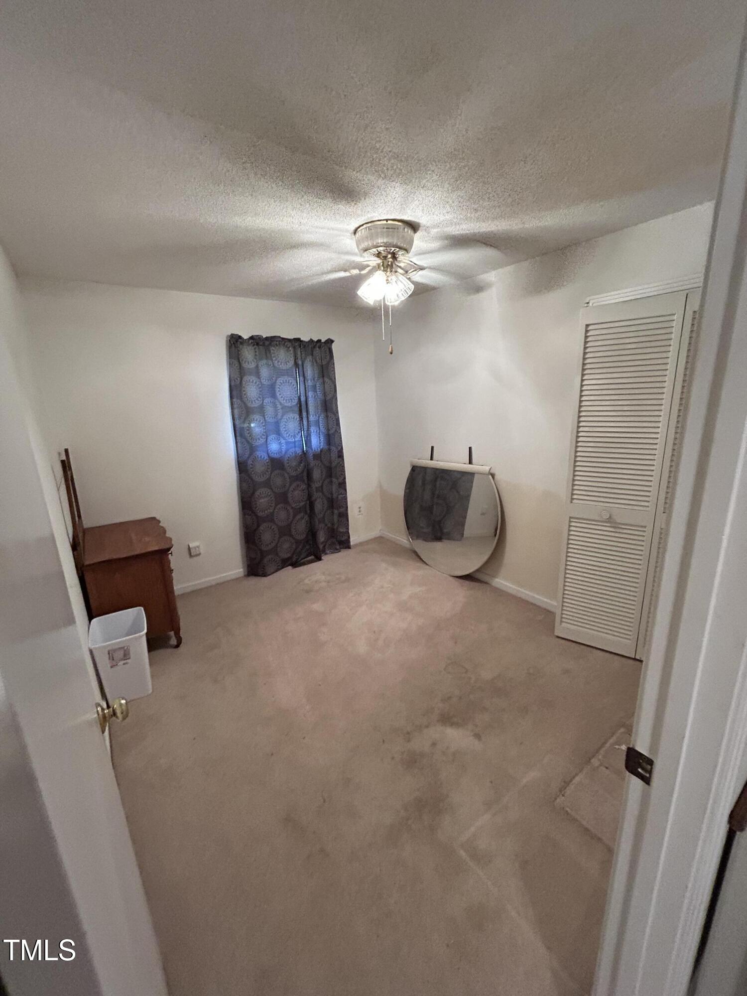 683 Osgood Road Sanford, NC 27330 - Photo 10 of 13 a bedroom with a bed and a chandelier