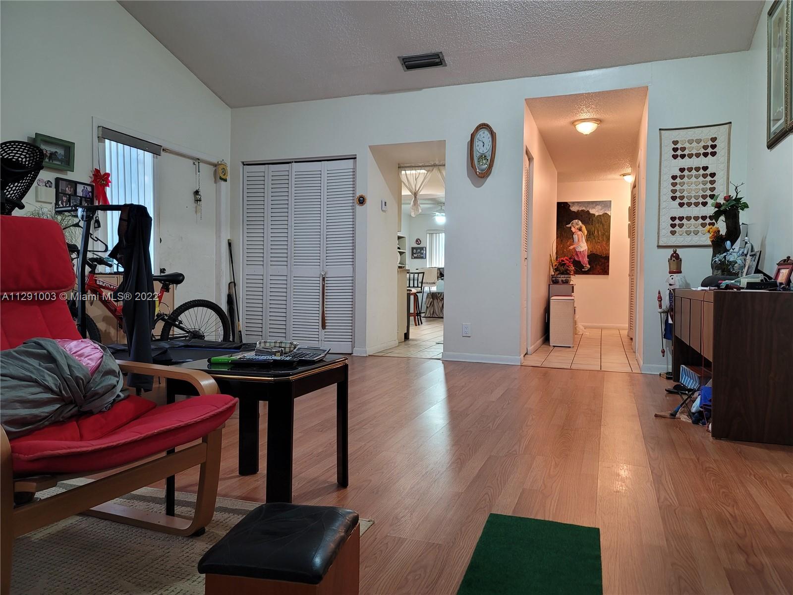 3931 Southwest 84th Terrace Davie, FL 33328 - Photo 15 of 15 a view of a workspace with furniture and wooden floor