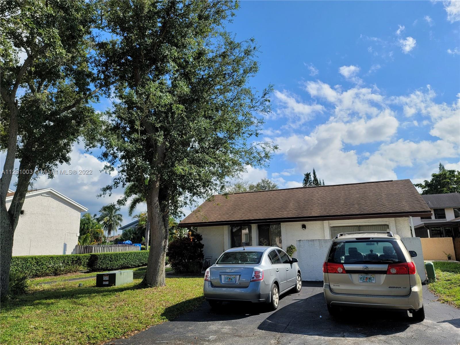 3931 Southwest 84th Terrace Davie, FL 33328 - Photo 5 of 15 a car parked in front of a house