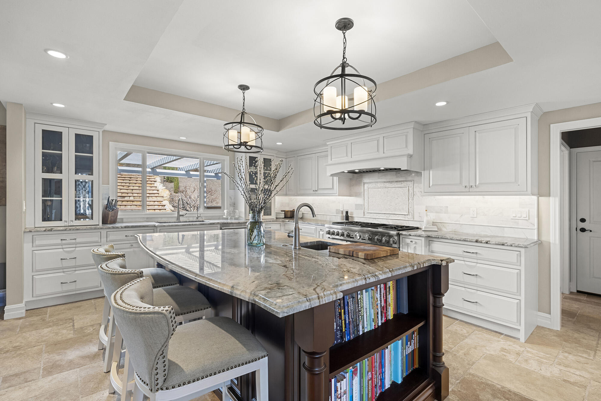 1855 Ringsted Drive Solvang, CA 93463 - Photo 11 of 30 a kitchen with kitchen island stainless steel appliances a stove center island and living room view