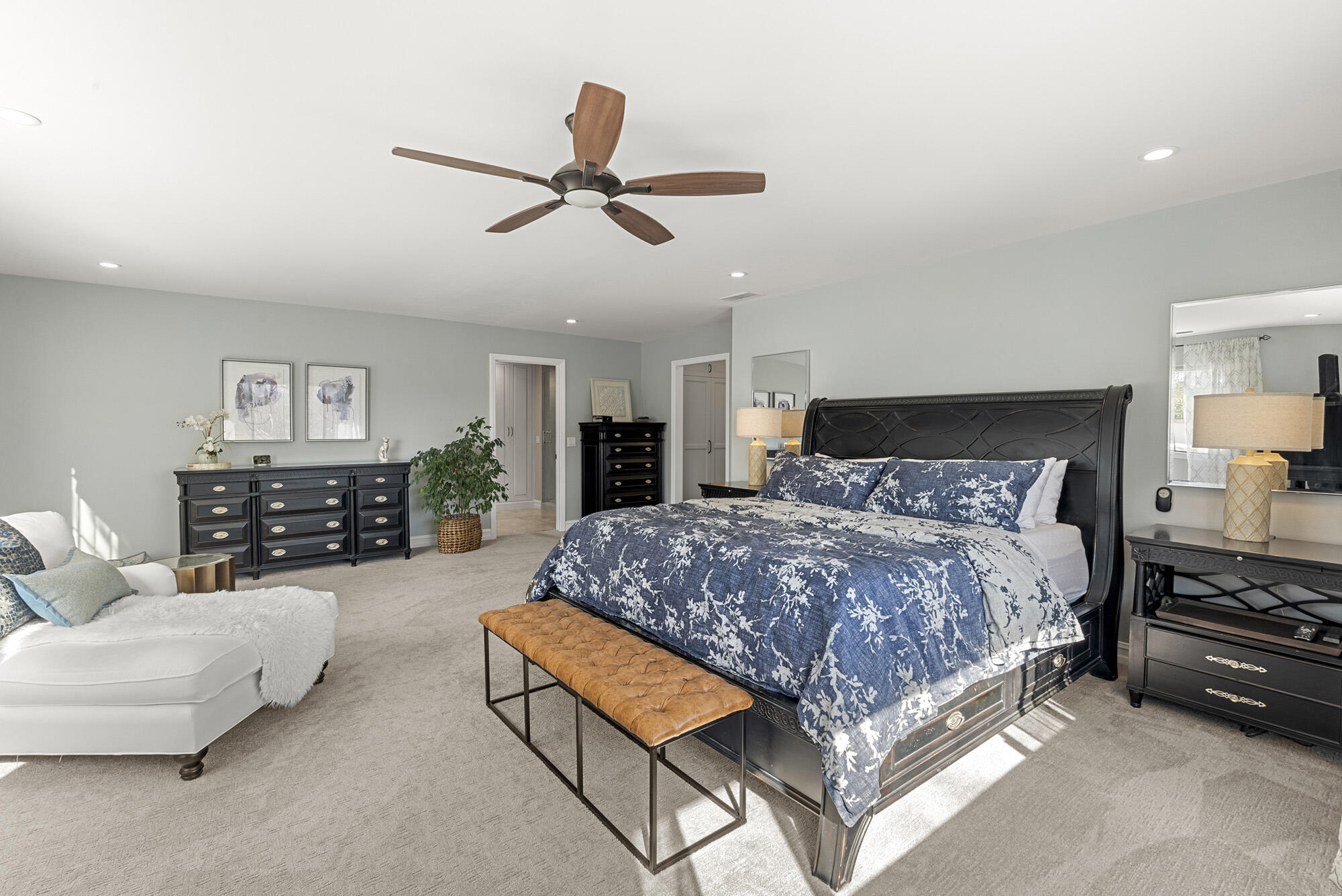 1855 Ringsted Drive Solvang, CA 93463 - Photo 18 of 30 a spacious bedroom with a bed a couch and a chandelier