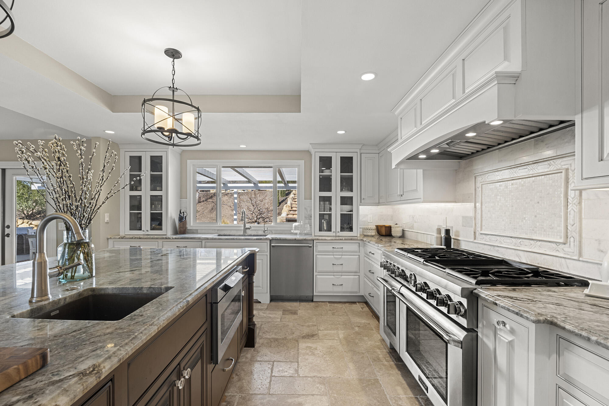 1855 Ringsted Drive Solvang, CA 93463 - Photo 2 of 30 a kitchen with a stove sink and cabinets