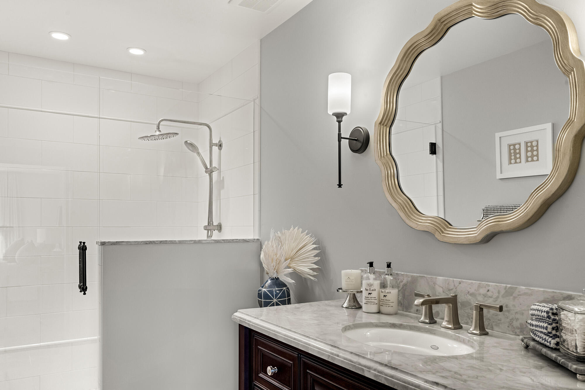 1855 Ringsted Drive Solvang, CA 93463 - Photo 22 of 30 a bathroom with a granite countertop sink a mirror and shower