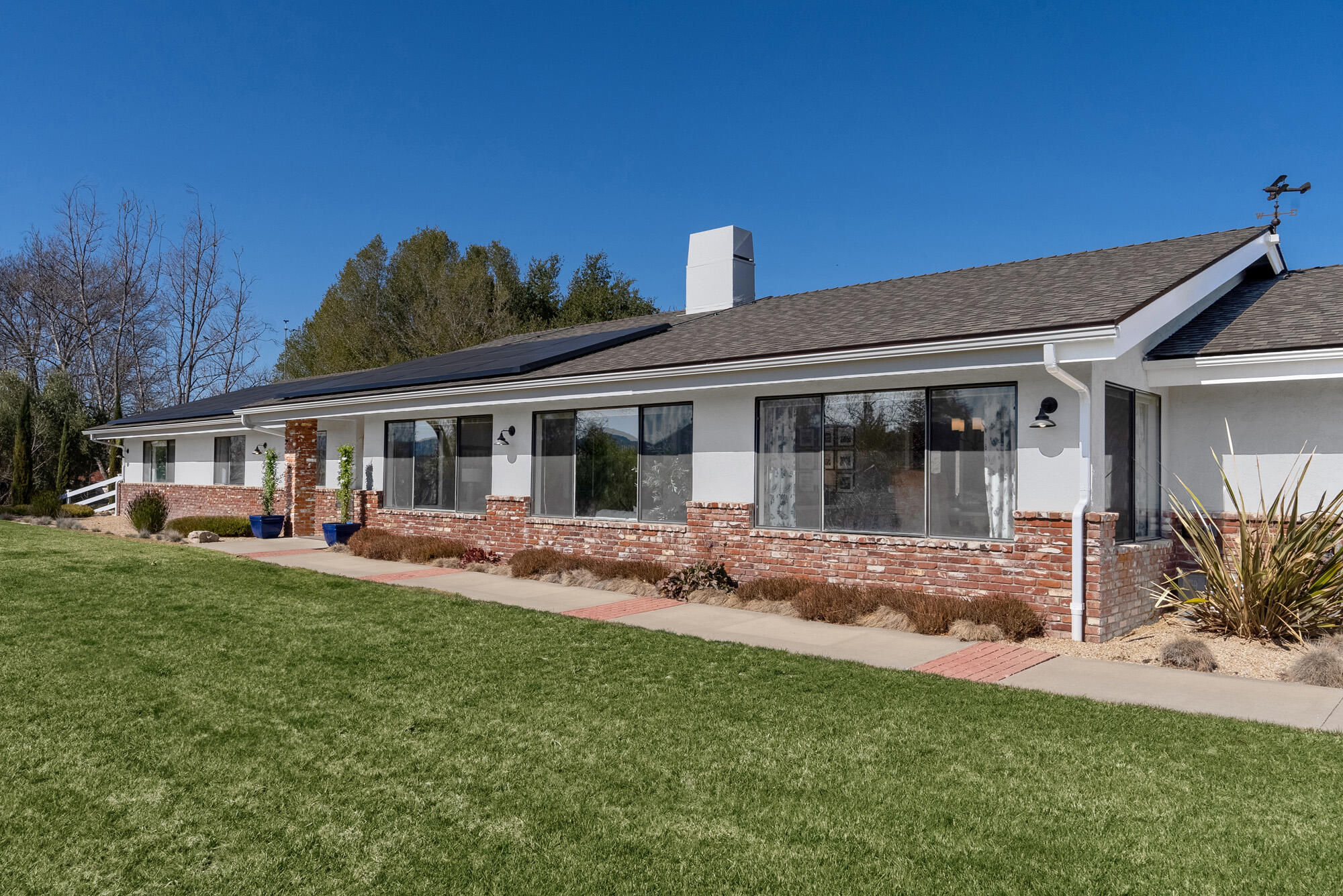 1855 Ringsted Drive Solvang, CA 93463 - Photo 4 of 30 a front view of a house with a garden and porch