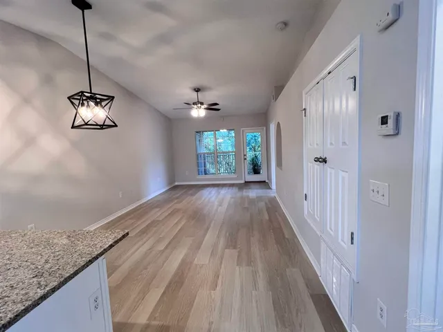 a view of a hallway with a chandelier