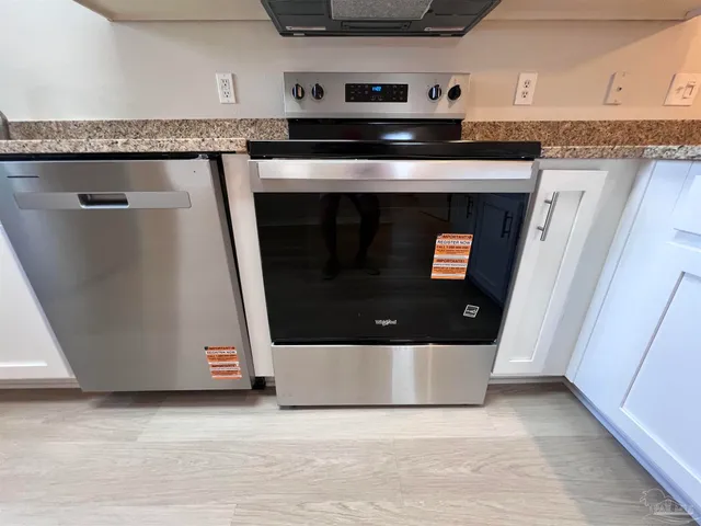 a close view of a stove top oven sitting inside of a kitchen